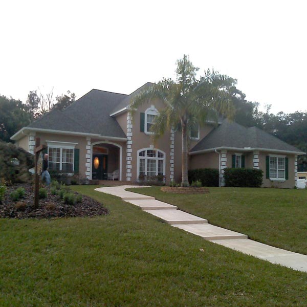 large home with new shingle roof